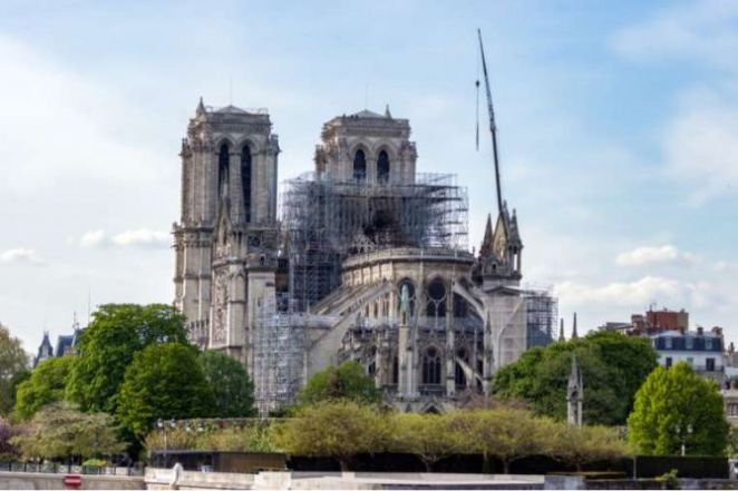 image:Image 26/source/orig/25002_notre-dame-cathedral-in-paris-the-day-after-a-massive-fire-damaged-parts-of-the-roof-and-structure-creditulyssepixel-shutterstock.jpg