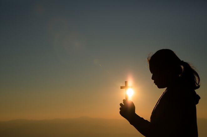 image:Image 74/source/orig/73910_teenage-girl-holding-cross-with-praying-peace-hope-dreams-concept.jpg